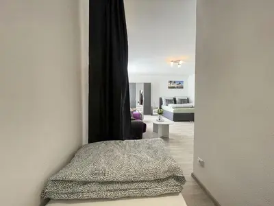 Ein Bett oder Betten in einem Zimmer der Unterkunft Perfekte 1,5 Wohnung Zentral in Leonberg gegenüber Einkaufzentrum