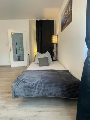 Ein Bett oder Betten in einem Zimmer der Unterkunft Perfekte 1,5 Wohnung Zentral in Leonberg gegenüber Einkaufzentrum
