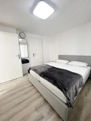Ein Bett oder Betten in einem Zimmer der Unterkunft Schickes Apartment in City Lage B7