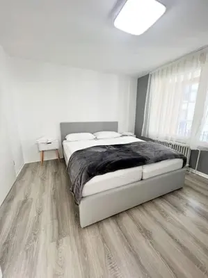 Ein Bett oder Betten in einem Zimmer der Unterkunft Schickes Apartment in City Lage B7