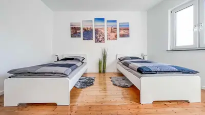 Ein Bett oder Betten in einem Zimmer der Unterkunft Houses in Gau-Bischofsheim