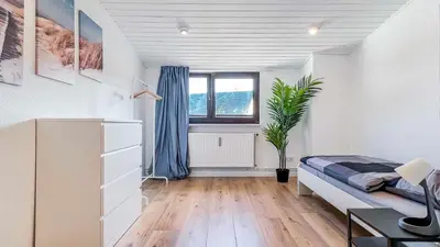 Ein Bett oder Betten in einem Zimmer der Unterkunft Houses in Gau-Bischofsheim