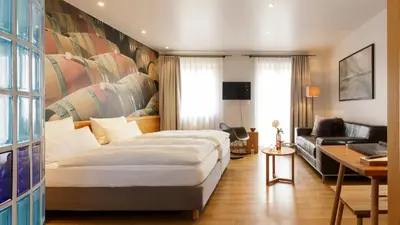 Ein Bett oder Betten in einem Zimmer der Unterkunft WeinHotel Fritz Walter
