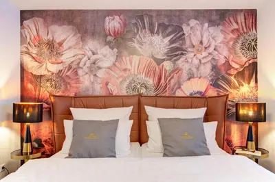 Ein Bett oder Betten in einem Zimmer der Unterkunft Blumen(t)raum Ferienwohnung 2