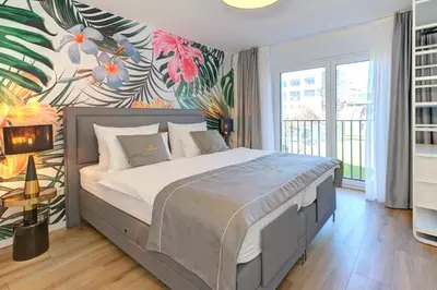 Ein Bett oder Betten in einem Zimmer der Unterkunft Blumen(t)raum Ferienwohnung 2