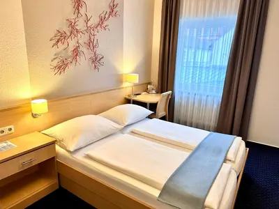 Ein Bett oder Betten in einem Zimmer der Unterkunft Hotel Friedrichstraße