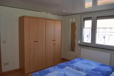 Ein Bett oder Betten in einem Zimmer der Unterkunft Ferienwohnung Am Neuberg