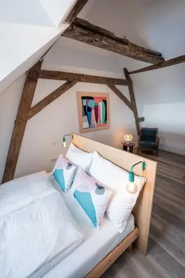 Ein Bett oder Betten in einem Zimmer der Unterkunft FREYZEIT Häuschen in Wachenheim an der Weinstraße