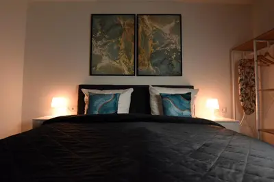 Ein Bett oder Betten in einem Zimmer der Unterkunft InHomeVision Neubau, Design, Balkon, Barrierefrei, WLAN