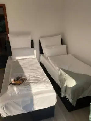 Ein Bett oder Betten in einem Zimmer der Unterkunft Kaffeehof 2 - FeWo in ruhiger Aussichtslage