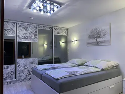Ein Bett oder Betten in einem Zimmer der Unterkunft Goldstadt Garden Residence - City Apartment Pforzheim