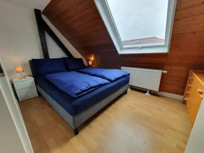 Ein Bett oder Betten in einem Zimmer der Unterkunft Gemütliche zentrale DG Wohnung in Mühlacker