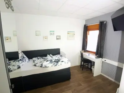 Ein Bett oder Betten in einem Zimmer der Unterkunft BoardingHouse Sinsheim zentral am Burgplatz