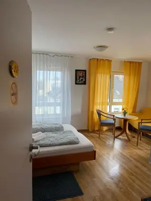 Ein Bett oder Betten in einem Zimmer der Unterkunft City Pension