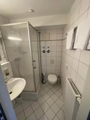 Ein Badezimmer in der Unterkunft City Pension