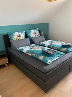 Ein Bett oder Betten in einem Zimmer der Unterkunft Ferienwohnungen Martin