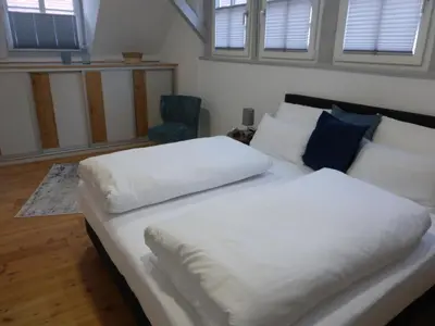 Ein Bett oder Betten in einem Zimmer der Unterkunft Ferienwohnung Färberloft