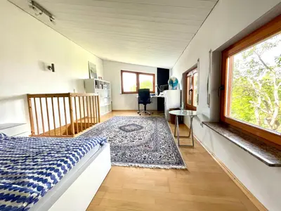 Ein Bett oder Betten in einem Zimmer der Unterkunft Herzensort - idyllisches Gästehaus für 2 im Garten