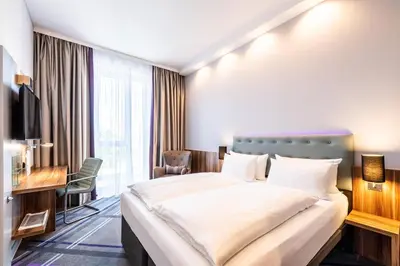 Ein Bett oder Betten in einem Zimmer der Unterkunft Premier Inn Heidelberg City Centre