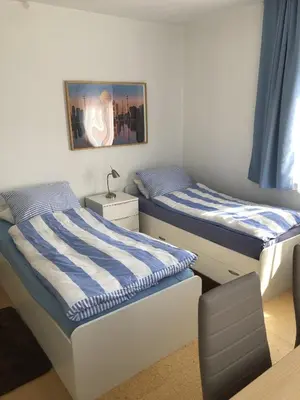 Ein Bett oder Betten in einem Zimmer der Unterkunft Gästehaus Lützelbach