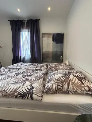 Ein Bett oder Betten in einem Zimmer der Unterkunft Nibelungen 4 Zimmer Apartment