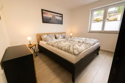 Ein Bett oder Betten in einem Zimmer der Unterkunft Ferienwohnung Am Ringelsberg