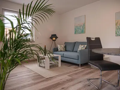 Ein Sitzbereich in der Unterkunft Ferienwohnung Am Ringelsberg