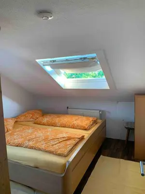 Ein Bett oder Betten in einem Zimmer der Unterkunft Ferienwohnung in Bad Rappenau