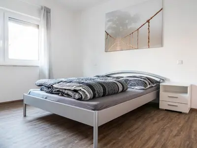 Ein Bett oder Betten in einem Zimmer der Unterkunft Wohnung Forst