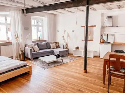 Ein Sitzbereich in der Unterkunft Ferienwohnung in maison de grès