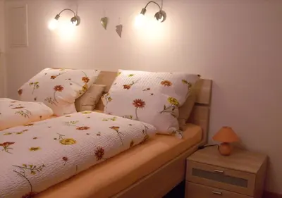 Ein Bett oder Betten in einem Zimmer der Unterkunft Ferienwohnung Weitsicht
