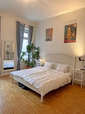 Ein Bett oder Betten in einem Zimmer der Unterkunft Mediterrane EG-Wohnung / BASF-Nähe / 650mbit WLAN