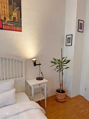 Ein Bett oder Betten in einem Zimmer der Unterkunft Mediterrane EG-Wohnung / BASF-Nähe / 650mbit WLAN