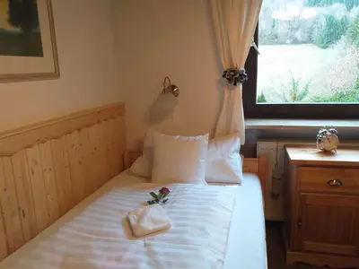 Ein Bett oder Betten in einem Zimmer der Unterkunft Ferienwohnungen Tannenhof