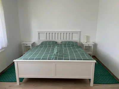 Ein Bett oder Betten in einem Zimmer der Unterkunft Weingut Sparrmühle Clarissa und Werner Manz GbR