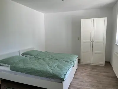 Ein Bett oder Betten in einem Zimmer der Unterkunft Weingut Sparrmühle Clarissa und Werner Manz GbR