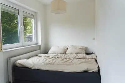 Ein Bett oder Betten in einem Zimmer der Unterkunft Appartment in den Weinbergen bei Mainz - mit 2x Doppelzimmern, 1x großes Wohnzimmer, Bad & Küche