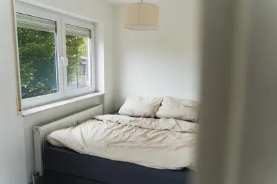 Ein Bett oder Betten in einem Zimmer der Unterkunft Appartment in den Weinbergen bei Mainz - mit 2x Doppelzimmern, 1x großes Wohnzimmer, Bad & Küche