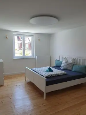 Ein Bett oder Betten in einem Zimmer der Unterkunft 3.OG / Top 4 Zimmer Wohnung KA-West