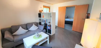 Ein Sitzbereich in der Unterkunft Ferienwohnung Strata Montana