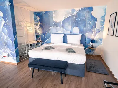 Ein Bett oder Betten in einem Zimmer der Unterkunft City Loft - 5 Min Rhein-Galerie