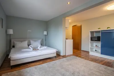 Ein Bett oder Betten in einem Zimmer der Unterkunft Family and Friends Hassloch