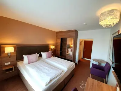 Ein Bett oder Betten in einem Zimmer der Unterkunft Hotel in den Herrnwiesen