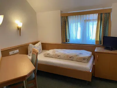 Ein Bett oder Betten in einem Zimmer der Unterkunft Landgasthaus zum Hirsch