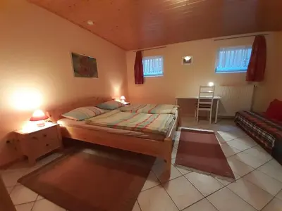 Ein Bett oder Betten in einem Zimmer der Unterkunft Ferienwohnungen Röller