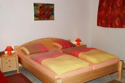 Ein Bett oder Betten in einem Zimmer der Unterkunft Ferienwohnungen Röller