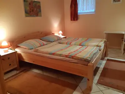 Ein Bett oder Betten in einem Zimmer der Unterkunft Ferienwohnungen Röller