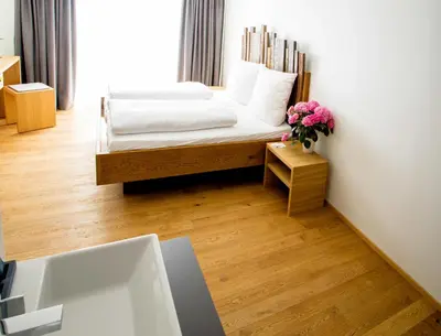 Ein Bett oder Betten in einem Zimmer der Unterkunft Der espenhof Landhotel, Tagungshotel & Weingut