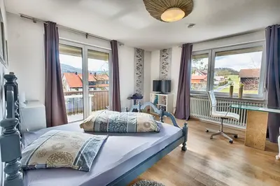 Ein Bett oder Betten in einem Zimmer der Unterkunft Pension Weinsberger Tal