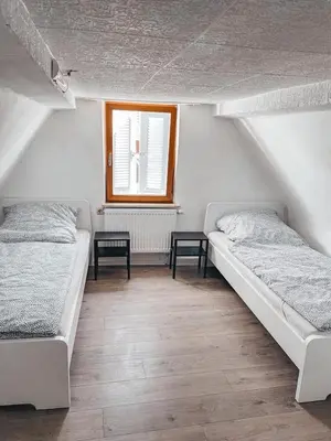 Ein Bett oder Betten in einem Zimmer der Unterkunft Unterkunft SL